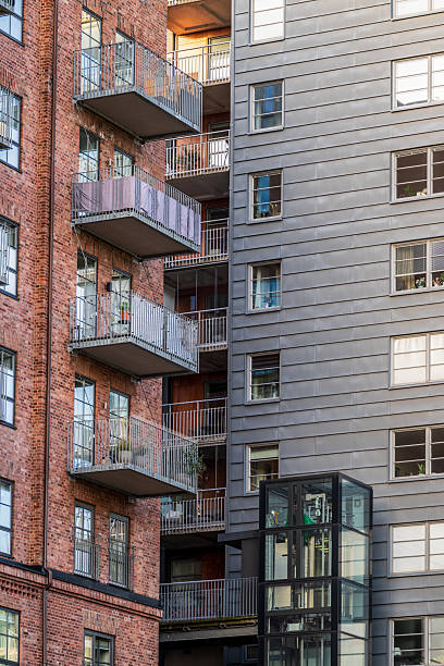 istock contrast between brick and metal residential buildings.. 2209238170