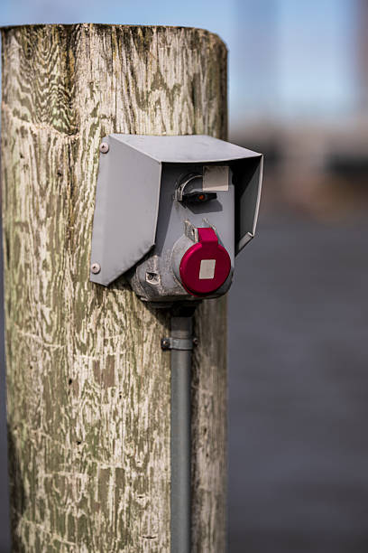 istock Close-up of industrial power socket on dock post.. 2209238313