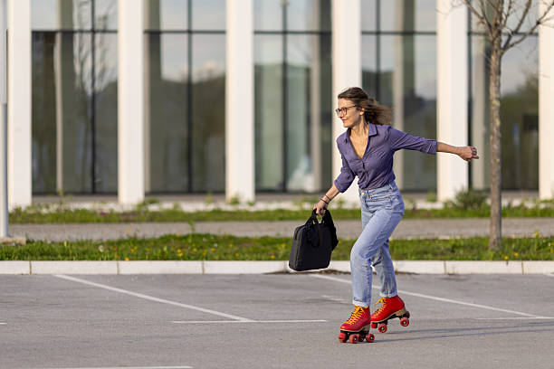 istock Confident business woman roller skating to work on a sunny day 2209245106