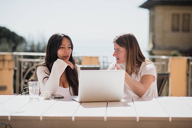 istock Young Female Entrepreneurs Working Remotely from Vacation 2209246132
