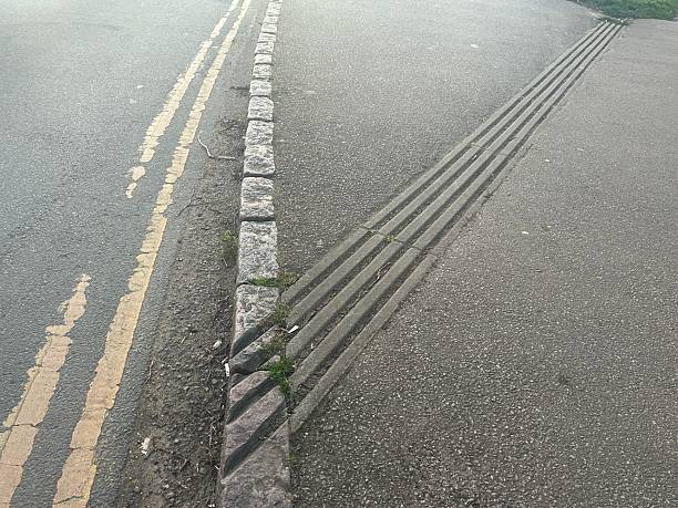 istock Pavement drainage channels, designed to control the flow of water 2209248195
