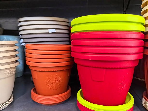 istock Vibrant flower pots stacked on a shelf for gardening lovers 2209250549
