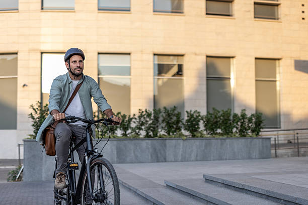 istock Businessman riding a bicycle in the city during commuting 2209251664