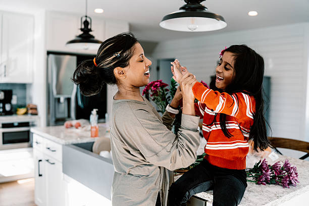 istock Mom spending time at home with playful daughter 2209252635
