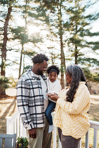istock Multi-generation family relaxing at home outside 2209252733