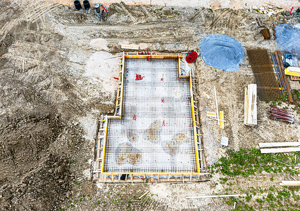 istock Aerial View of Construction Site with Concrete Foundation 2209259010