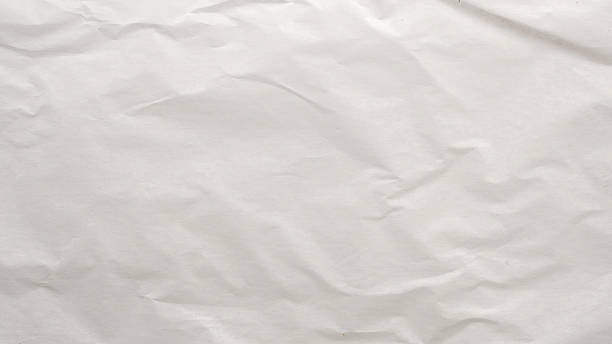 istock Abstract white crumpled and creased recycle paper texture background 2209259296