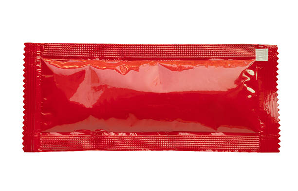 istock Blank red foil tomato ketchup sauce sachet package isolated on white background 2209259341