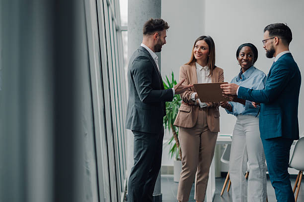 istock Business people discussing work in modern office 2209259882