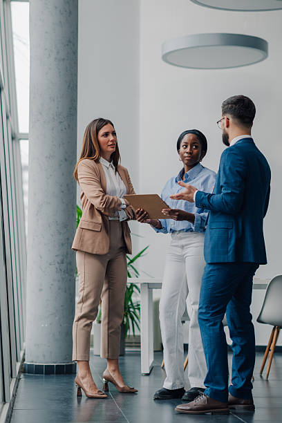 istock Business team discussing work in modern office 2209259896