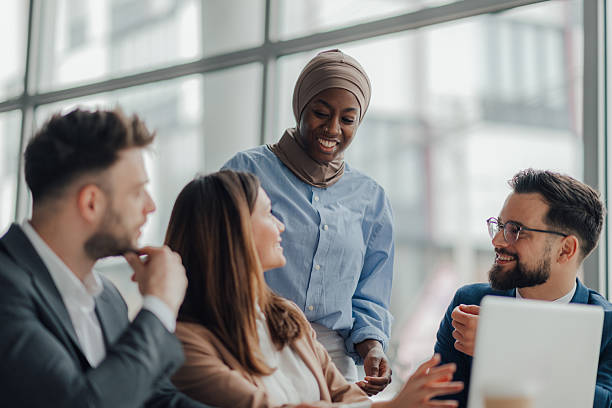 istock Diverse business team collaborating on project in modern office 2209259955