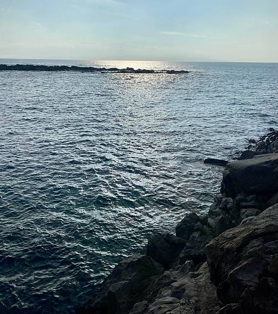 istock Shimmering Ocean Beyond Coastal Rocks 2209261387