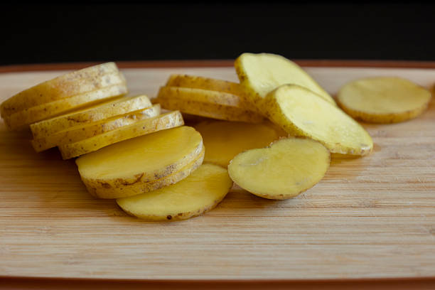 Sliced potatoes on a cutting board. Selective focus.