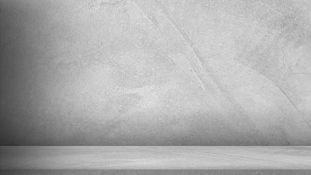istock Wall display product and text present on free space, empty grey cement wall floor and wall room loft style, Perspectives background of cement texture loft style with shadow, Luxury backdrop. 2209269946