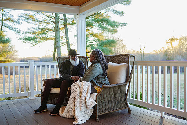 istock Senior couple relaxing on patio at sunset 2209270089