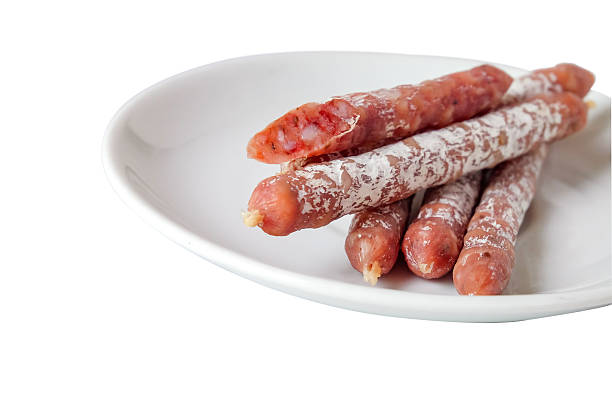 istock Cured salami sticks or Smoked sausage on white background. 2209270534