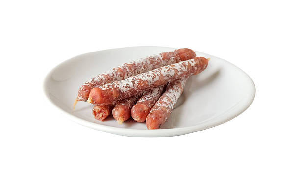 istock Cured salami sticks or Smoked sausage on white background. 2209270556