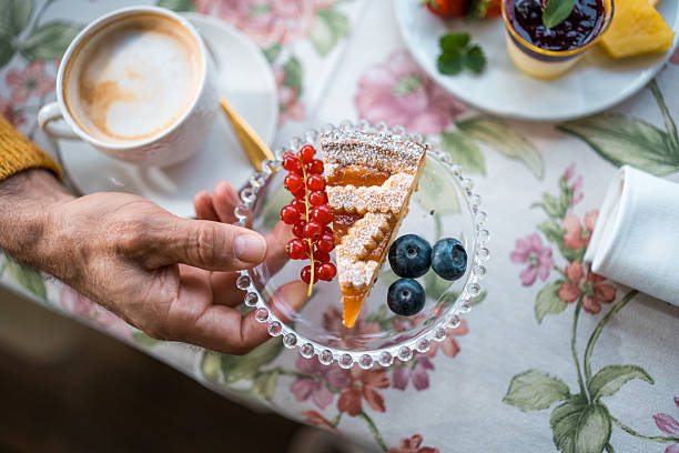istock Senior Gentleman Enjoying Gourmet Breakfast 2209272717
