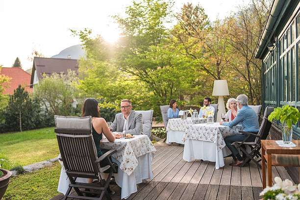 istock Diverse Guests Enjoying Alfresco Dining at Boutique Hotel 2209272762