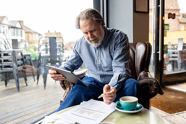 istock Business owner doing the accountancy at a cafe 2209273713