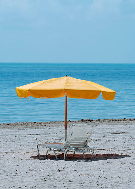 yellow umbrella on the beach time vacation in Miami, Florida, United States