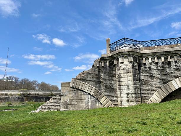 istock Weathered ruins of stone bridge under blue sky in Eden Park 2209274926