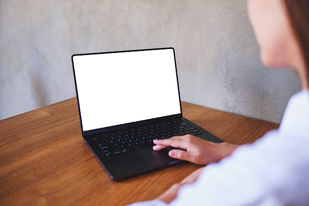 istock Mockup image of a woman using and typing on computer laptop with blank desktop screen 2209277105