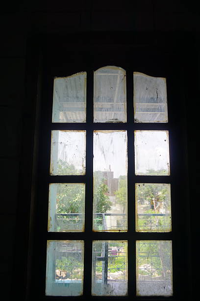 istock Old window, city view, dusty panes, building interior, design element 2209280506