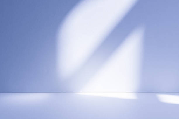 istock Studio style background wall decoration presentation uses white and blue tones. with shadows cast from a nearby window, concept creating a decorative 2209280929