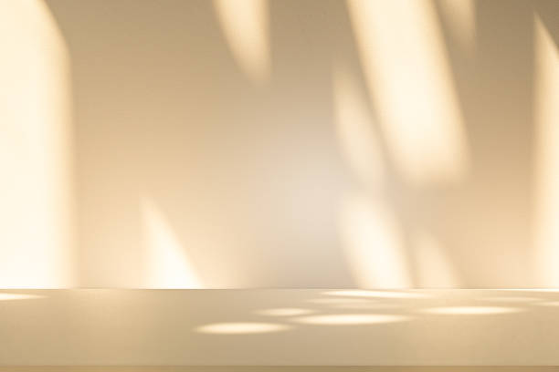 istock Studio style background wall decoration presentation uses white and beige tones. with shadows cast from a nearby window, concept creating a decorative 2209280931