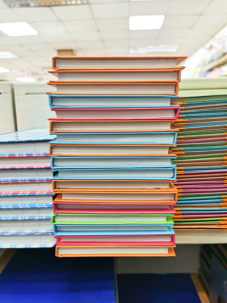 istock A stack of colorful books on a wooden shelf. 2209281538