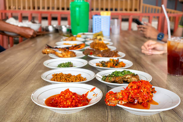 Side dishes on plates served on the table. Typical Minangkabau cuisine.