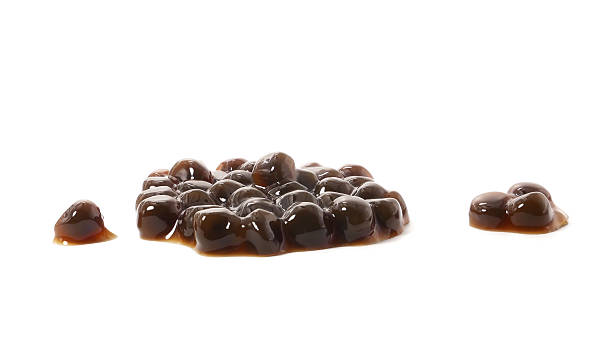 istock Brown sugar pearls bubble isolated on white background 2209291784