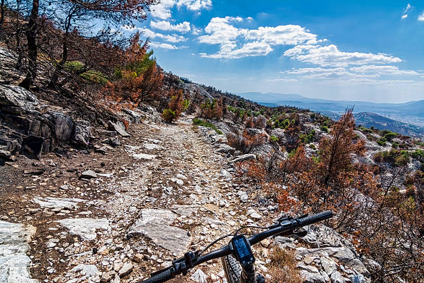 istock Cycling Through Burnt Rocky Trail Near Davelis Cave 2209293953