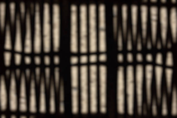 High angle view of defocused light and shadows of old Japanese earthen floor.