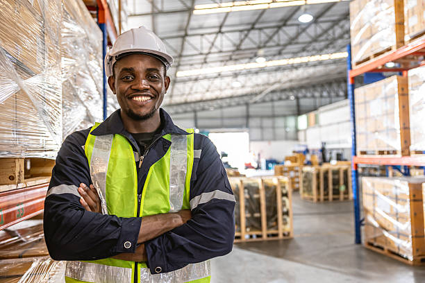 istock portrait black African professional worker standing confident happy smiling at warehouse cargo 2209295348