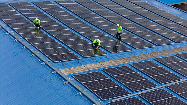istock Aerial view of Professional Engineer Team Service Solar Panel. Worker Maintenance Solar Panel. 2209295359
