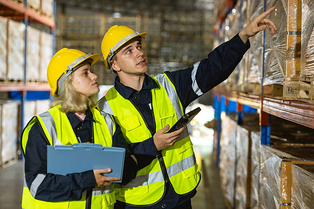 istock professional warehouse workers. caucasian stock inventory team staff working in cargo storage 2209295365