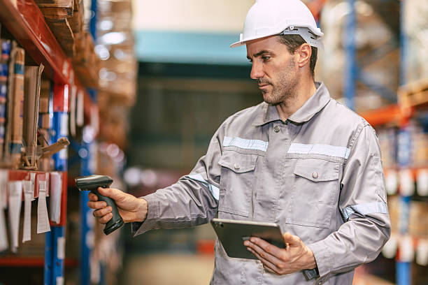 istock Warehouse worker working check inventory at shelf with barcode scan, Cargo employee staff in duty 2209295424