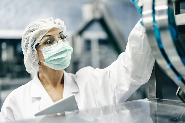 istock Industry inspector team working, QC staff work checking machine operation for safety and hygiene 2209296425