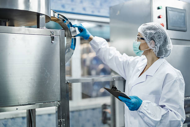 istock Industry inspector team working, QC staff work checking machine operation for safety and hygiene 2209296479