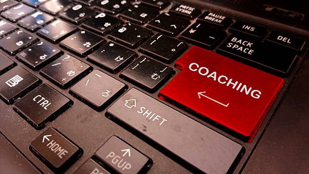 istock word COACHING writing on entering symbol keyboard 2209297416