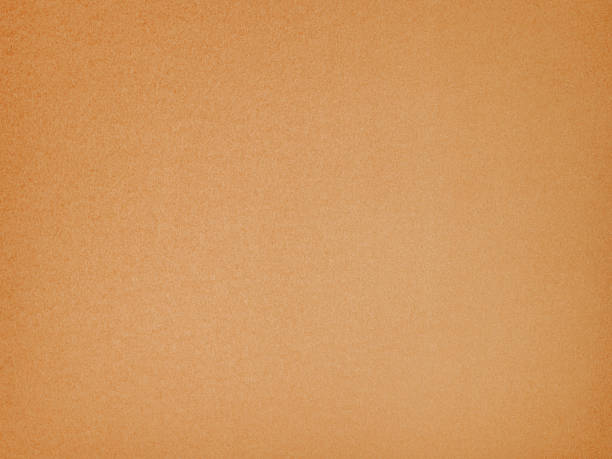 istock A light brown surface of uniform paper texture. Background, texture 2209299153