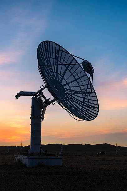 istock Observatory satellite receiving antenna at sunset 2209306546