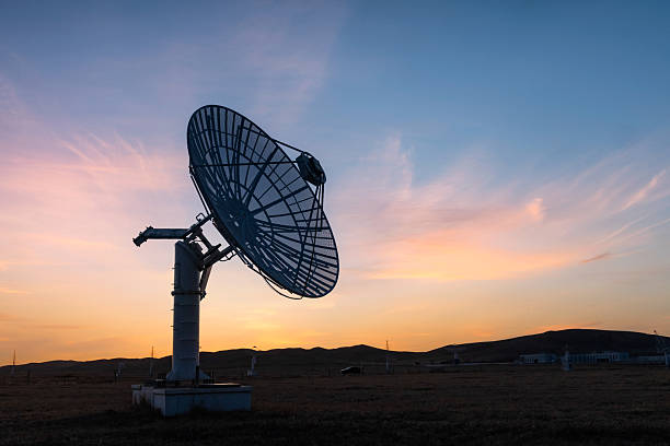 istock Observatory satellite receiving antenna at sunset 2209306548