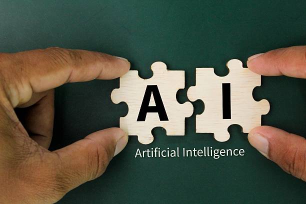 istock wooden puzzle with the letter AI or the word Artificial Intelligence 2209306940