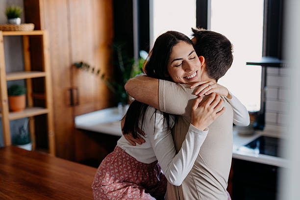 istock Young couple hugging in the kitchen 2209308758