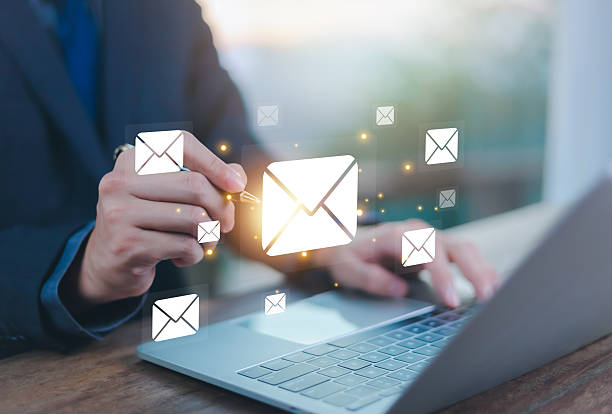 istock email communication, digital marketing, businessman responding to floating digital interface showing new email notification symbol. 2209324276