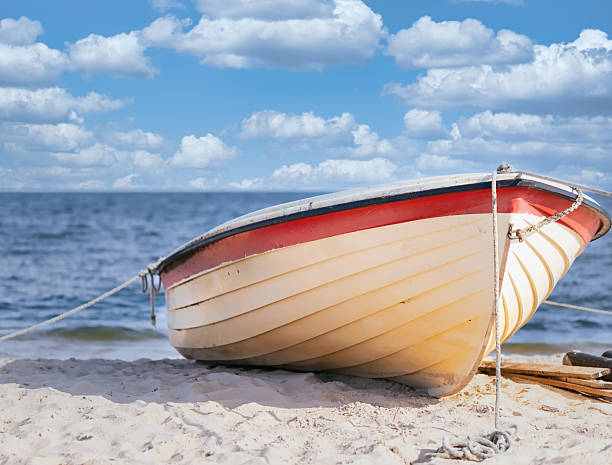 istock A fishing boat on the beach 2209324429
