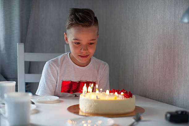istock Happy Boy Celebrating Birthday with Cake 2209324533